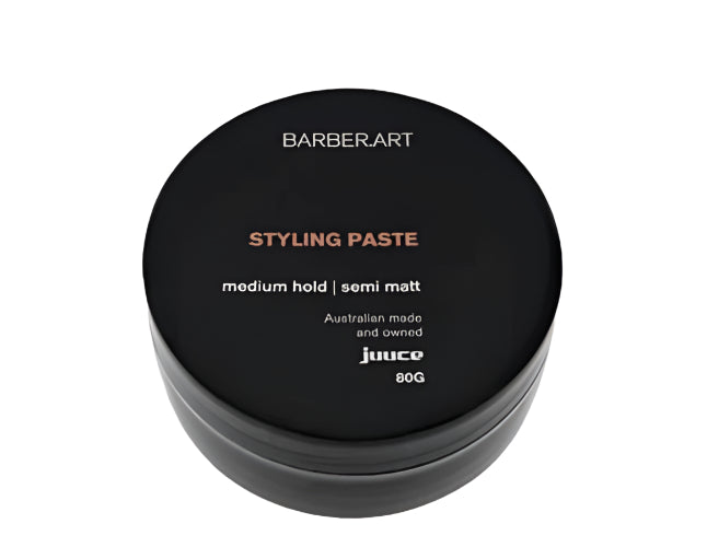Black container of BarberArt Styling Paste on a white background